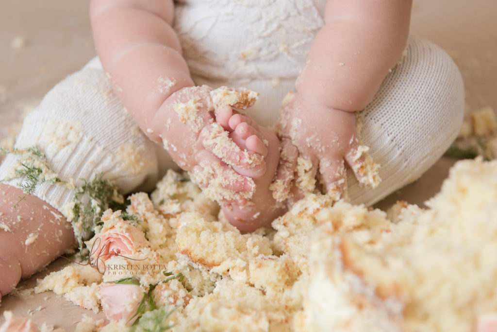 cake covered baby toes detail photo